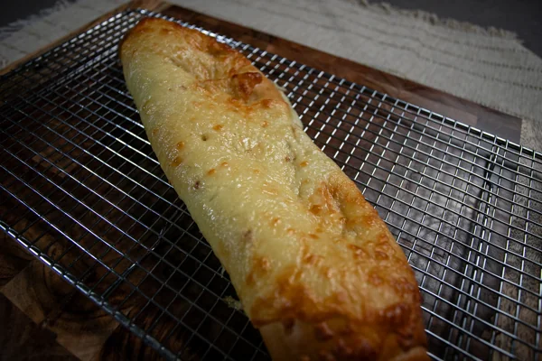 Pan de queso completo con acabado gratinado